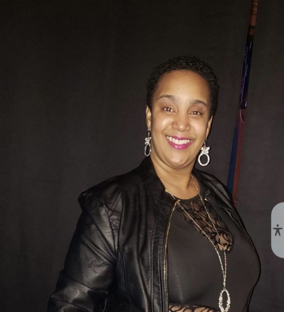 Fruitful Blessings Gourmet Catering serving a busy upscale event led by Shay Perkins with elegant food displays and guests enjoying premium catered dishes