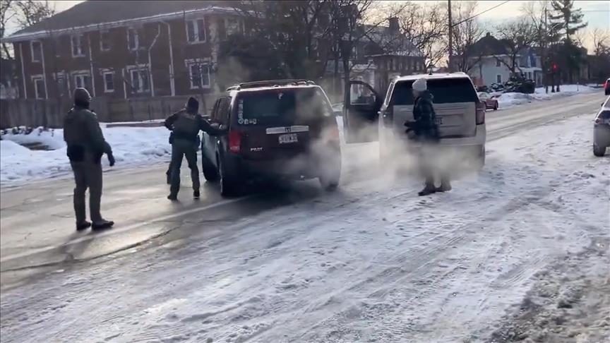 Federal ICE agents surrounding a vehicle in Minneapolis following the fatal shooting of Renee Good