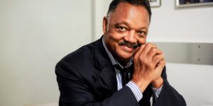 Jesse Jackson speaking passionately at a civil rights gathering
