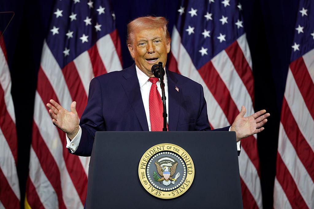 Donald Trump delivering a State of the Union address inside the US Capitol as members of Congress and media look on during a tense political moment