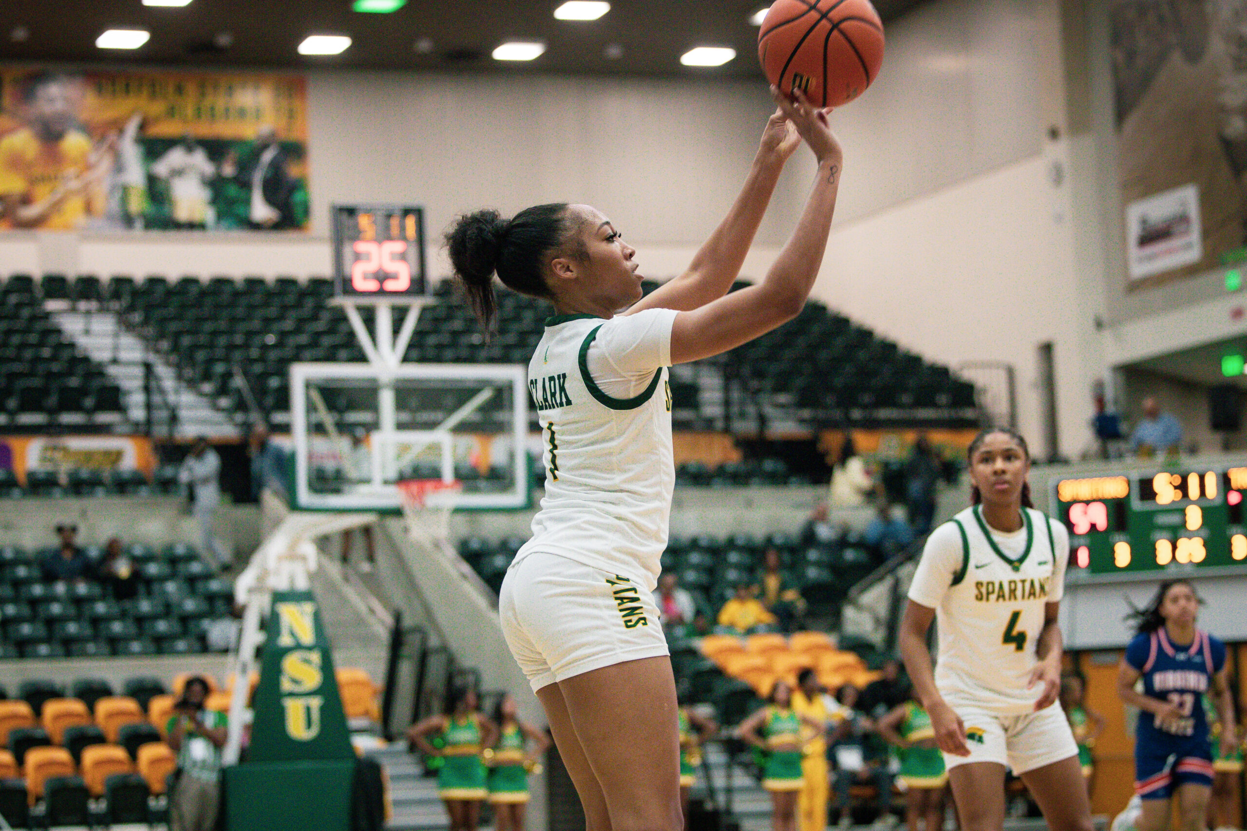 Da’Brya Clark celebrates during a women’s college basketball game after transferring from Norfolk State to Charlotte to play for coach Tomekia Reed.