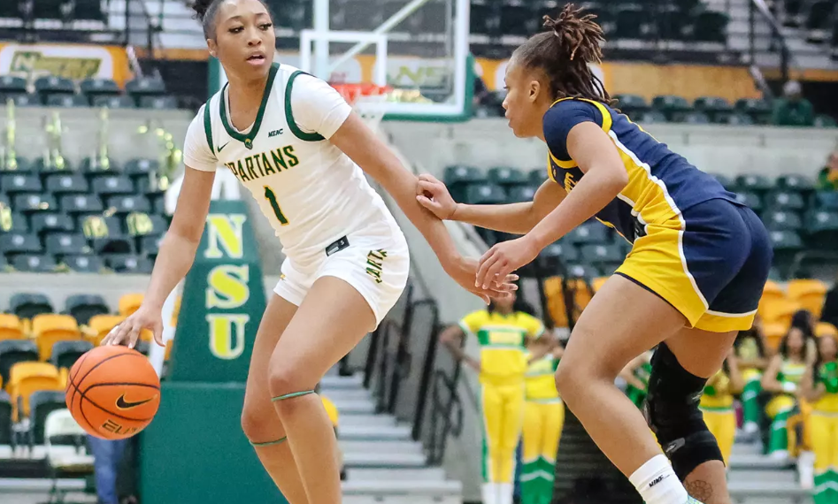 Da’Brya Clark celebrates during a women’s college basketball game after transferring from Norfolk State to Charlotte to play for coach Tomekia Reed.