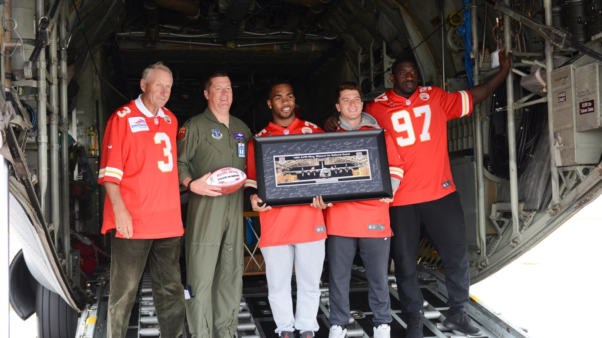 Allen Bailey wearing number 97 with teammates during a Chiefs visit to Rosecrans Air National Guard Base