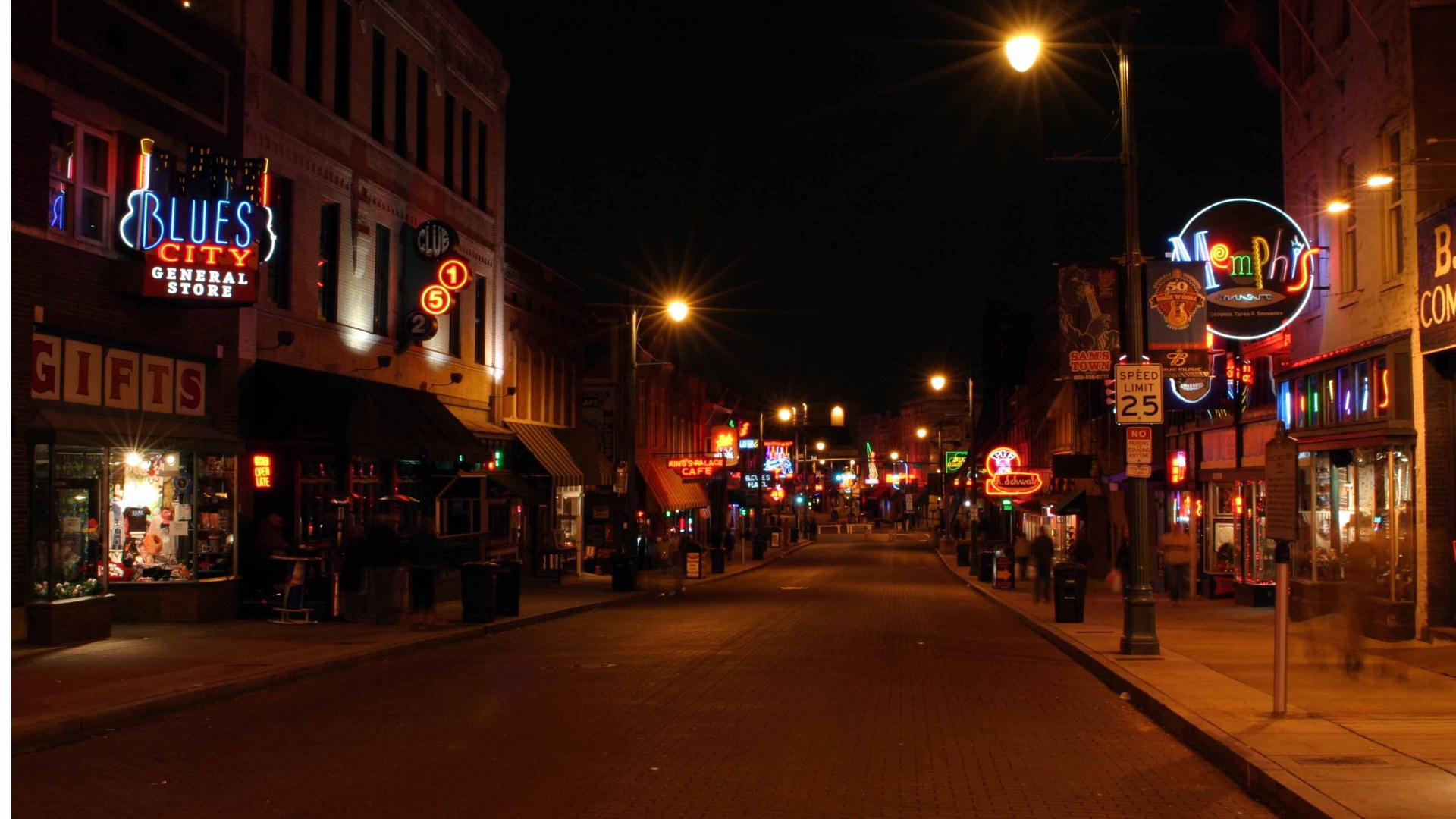 Beale Street in Memphis glowing with neon signs at night