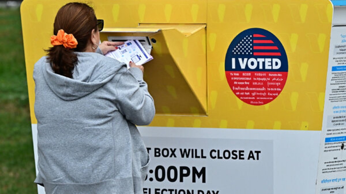 California voter dropping ballot at ballot box in Los Angeles County