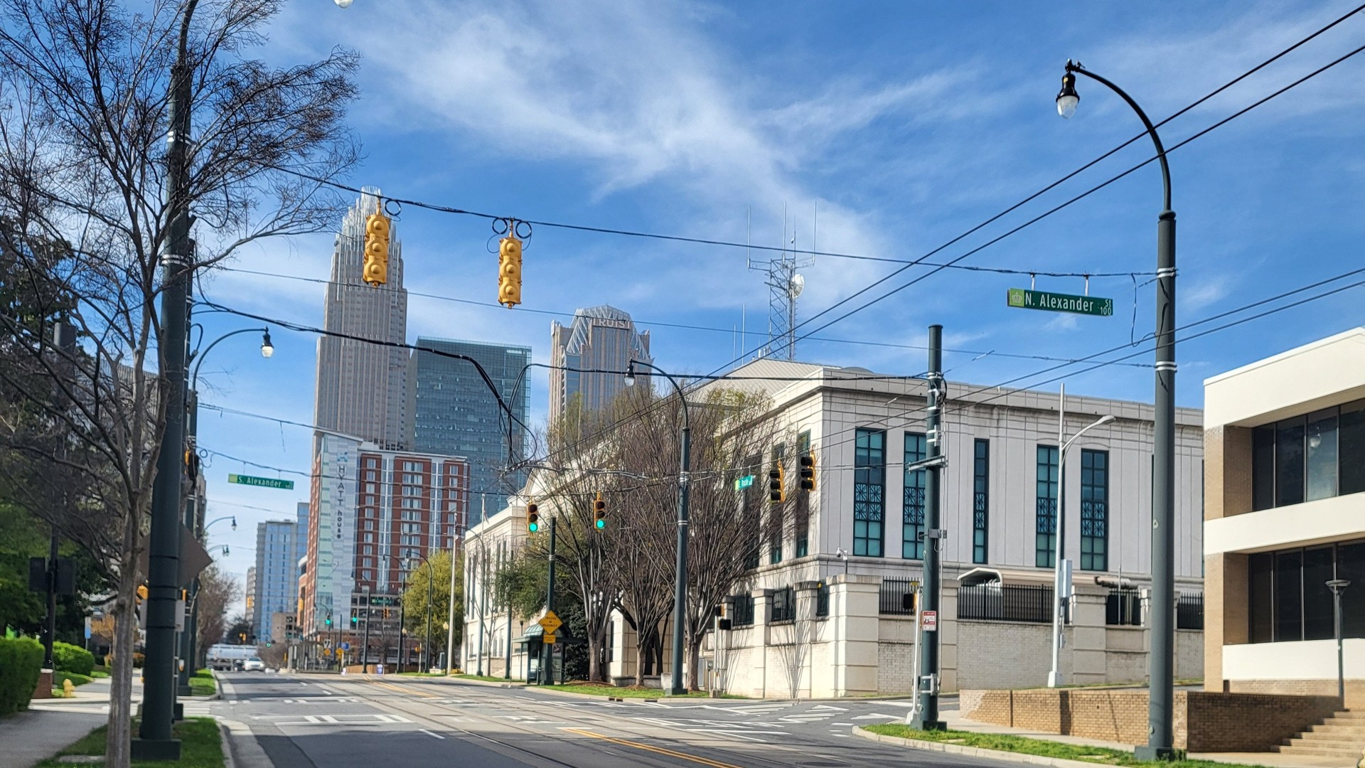 Charlotte Mecklenburg Police Department headquarters seen from East Trade Street with the uptown skyline behind it