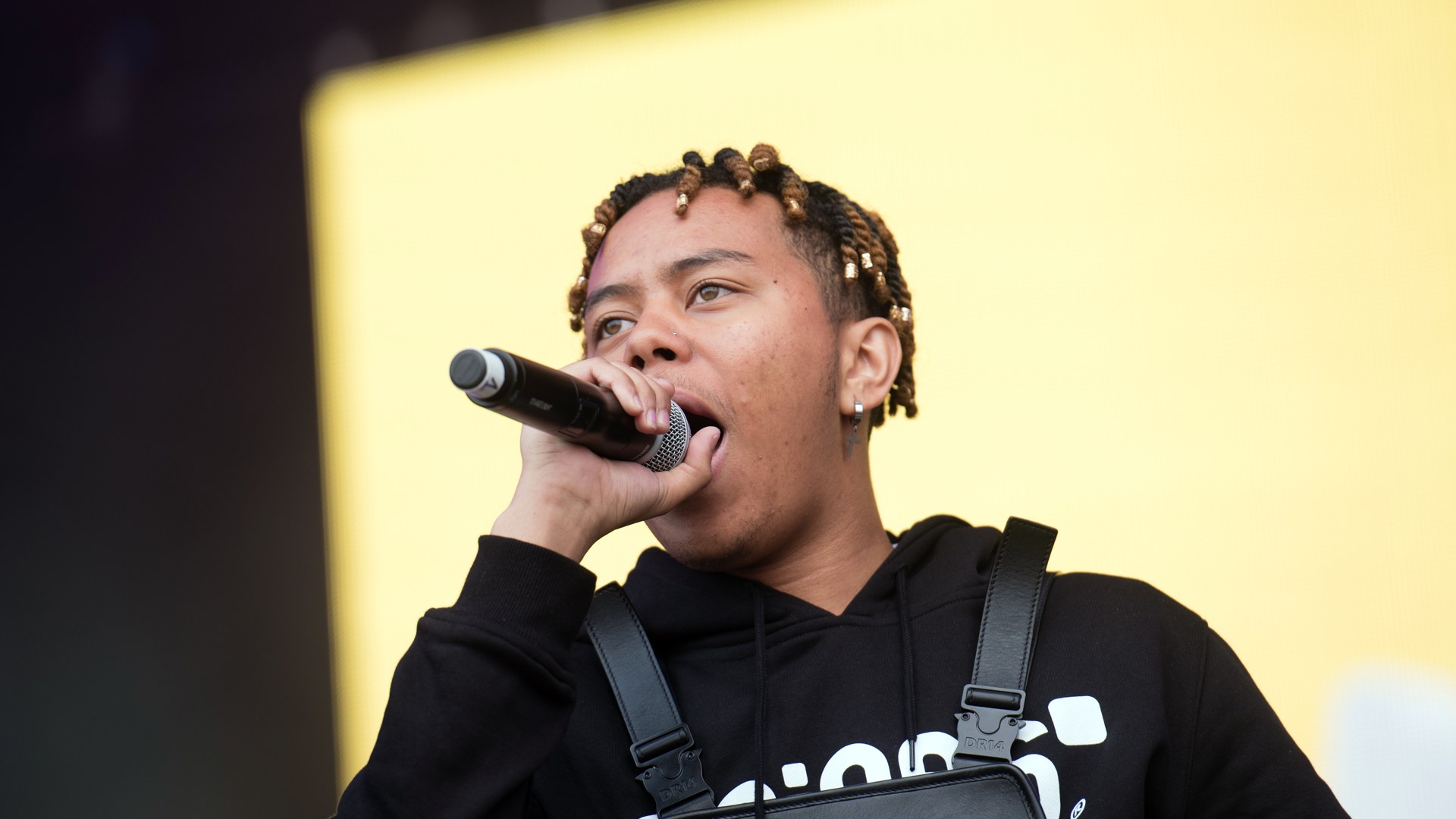 Cordae performing live at a festival in 2019