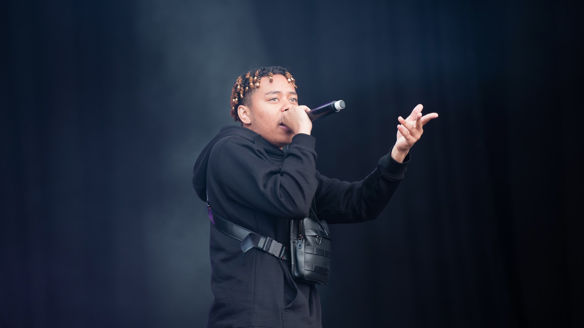 Cordae performing live on stage in 2019