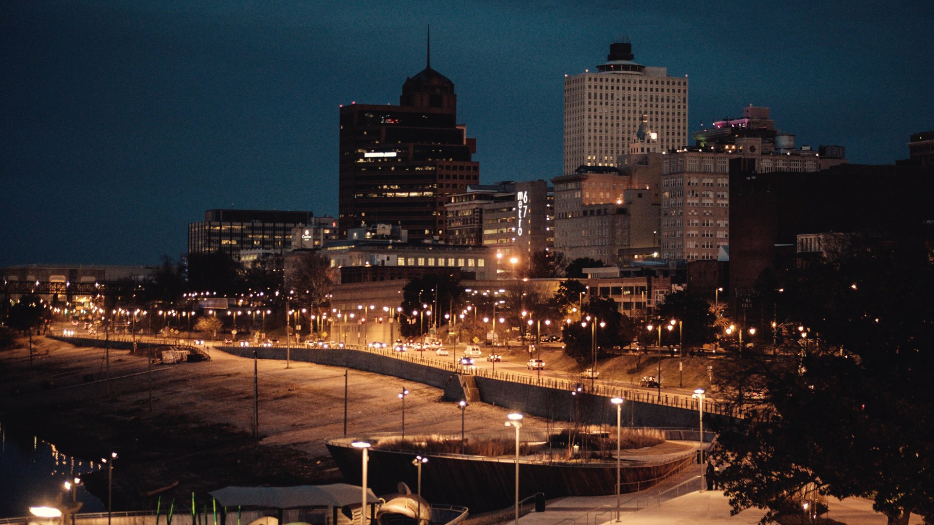 Memphis skyline glowing at night above the riverfront