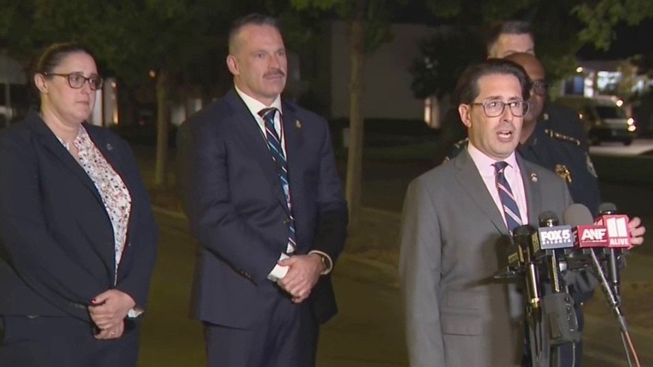 Federal officials announce an arrest at a nighttime news conference in Atlanta