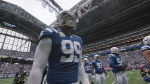 DeForest Buckner wearing his Indianapolis Colts uniform on the field at Lucas Oil Stadium