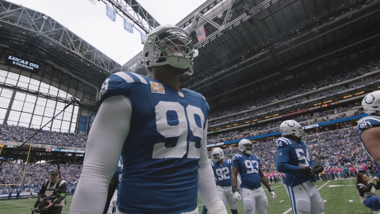 DeForest Buckner wearing his Indianapolis Colts uniform on the field at Lucas Oil Stadium