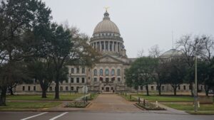 The Mississippi State Capitol building in Jackson with trees and lawns