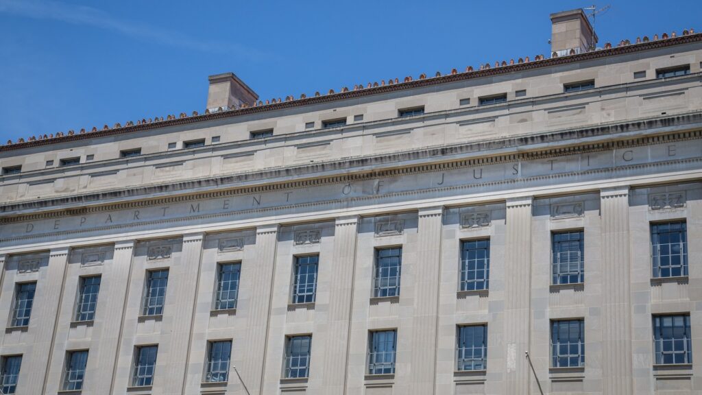 The Department of Justice headquarters building in Washington with its name carved in stone