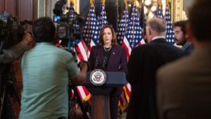 Kamala Harris speaking at a podium during an appearance