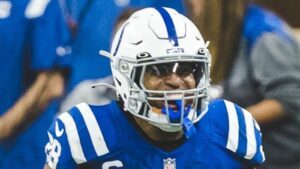 Jonathan Taylor smiling in his Indianapolis Colts helmet and blue uniform