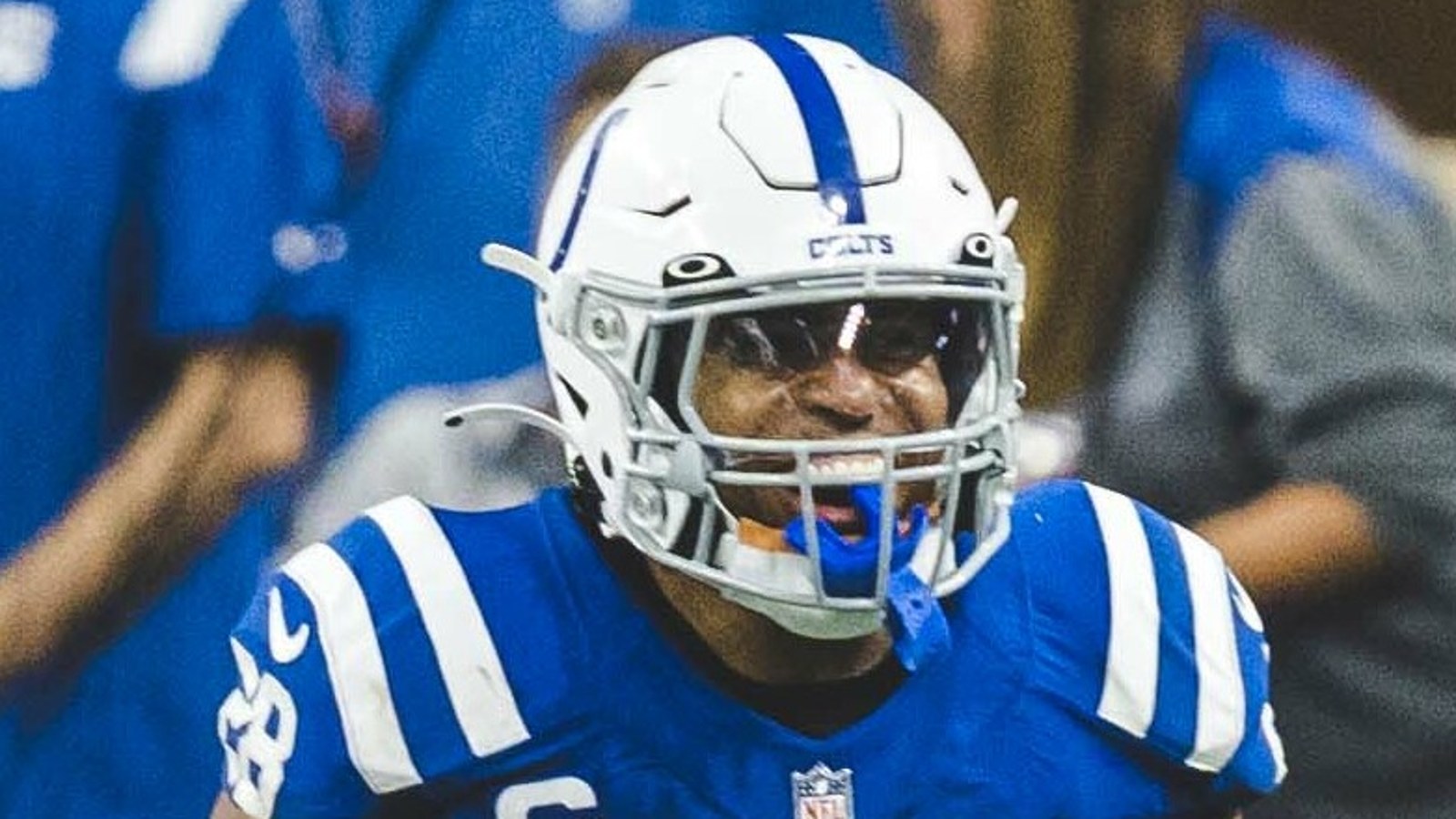 Jonathan Taylor smiling in his Indianapolis Colts helmet and blue uniform
