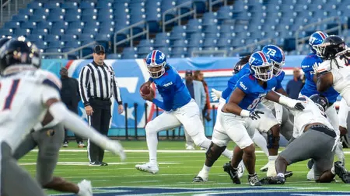 Tennessee State ball carrier runs against Morgan State at Nissan Stadium