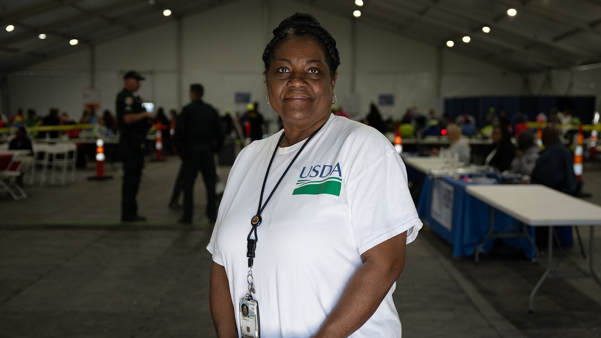 A USDA worker stands at a food assistance site in Florida