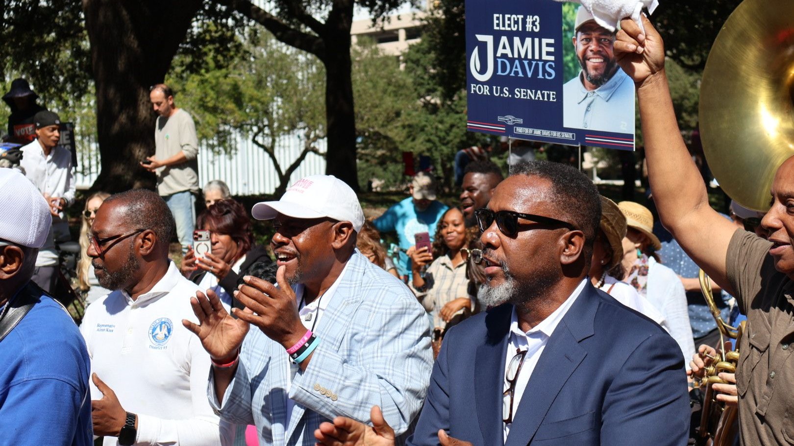 Supporters rallying with a Jamie Davis campaign sign in New Orleans