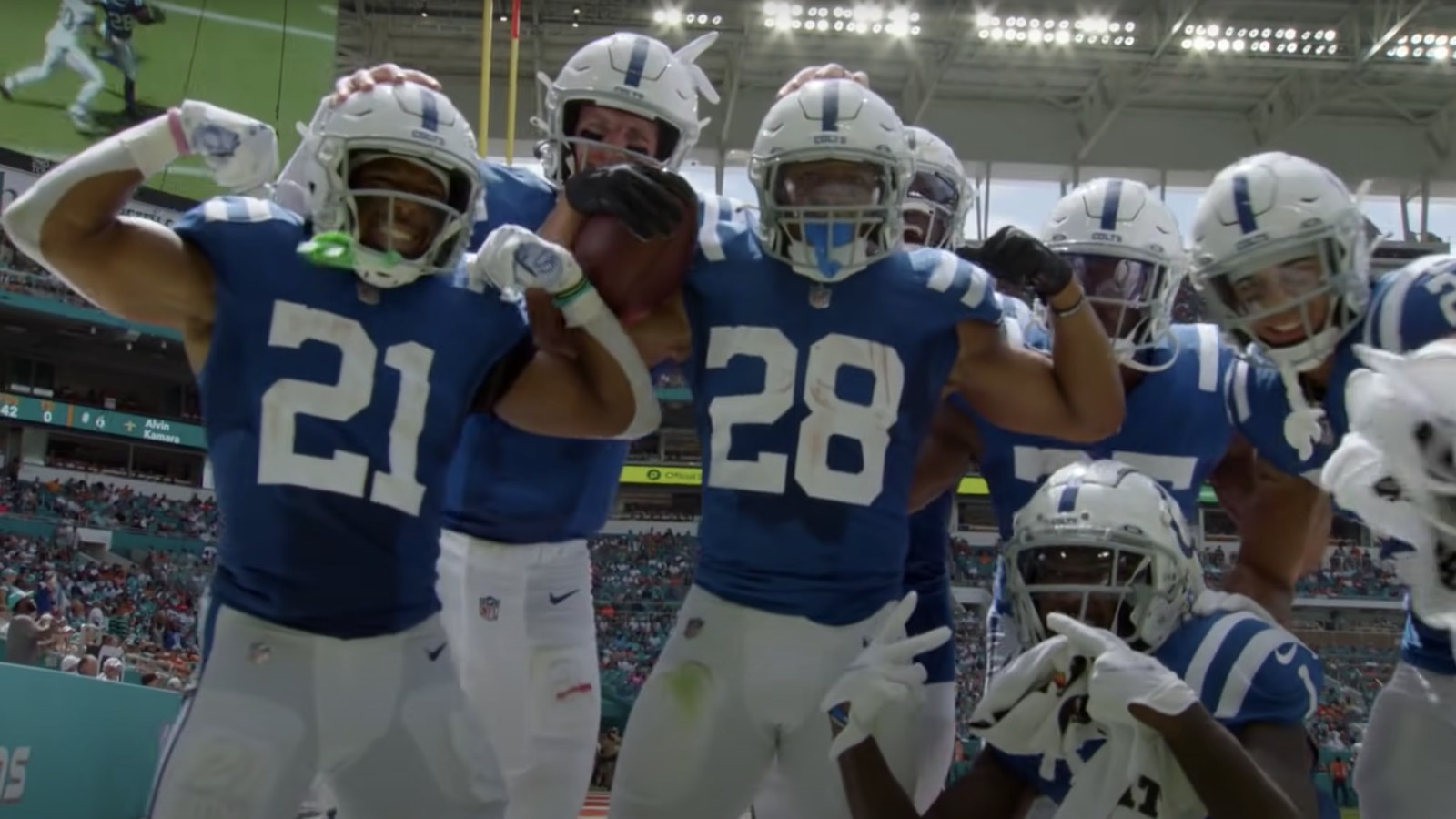 Jonathan Taylor flexing with Indianapolis Colts teammates after a touchdown at Miami
