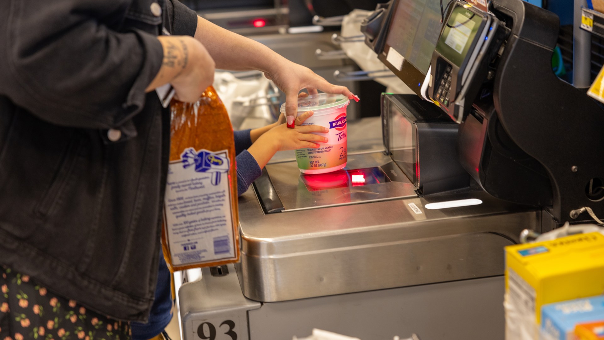 A family shopping for groceries with food assistance