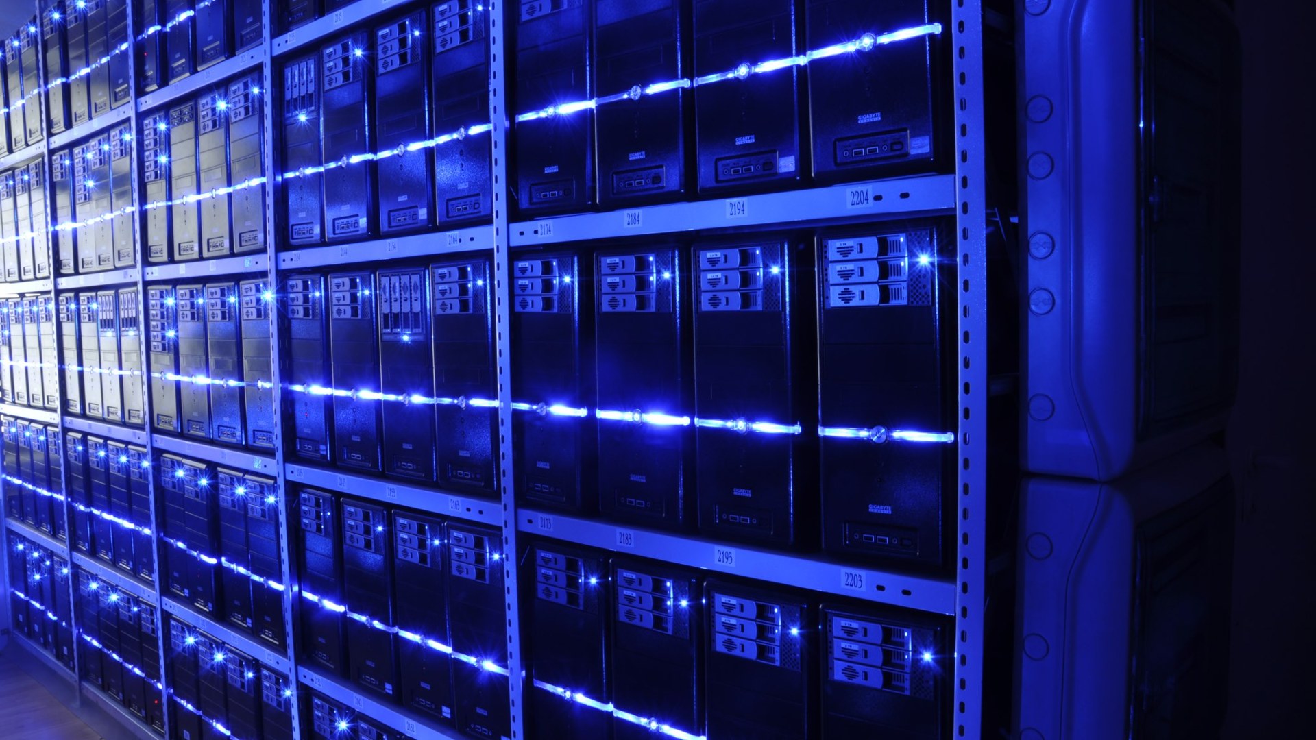Rows of servers inside a large data center facility
