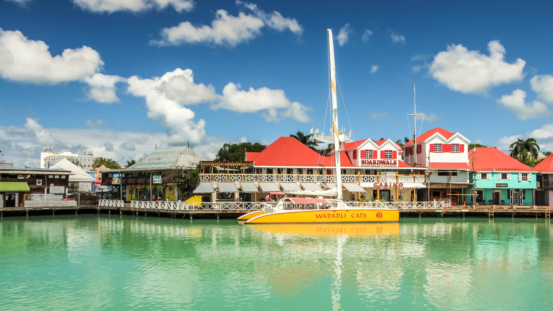 Waterfront buildings with red roofs at the port in St Johns Antigua