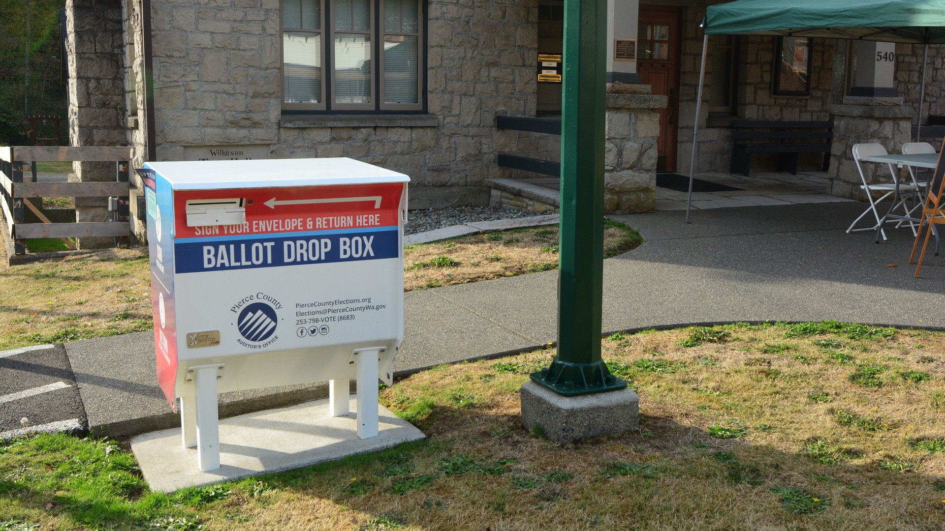 A white official ballot drop box in front of Town Hall in Wilkeson Washington