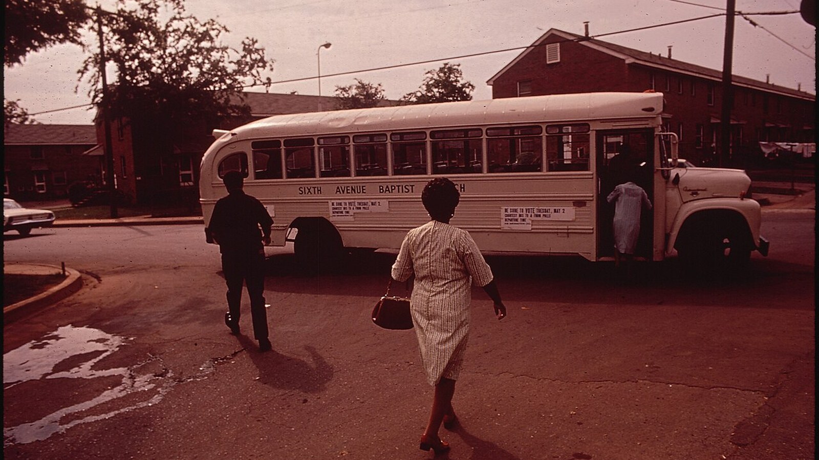 Black voters board a church bus bound for the polls in Birmingham