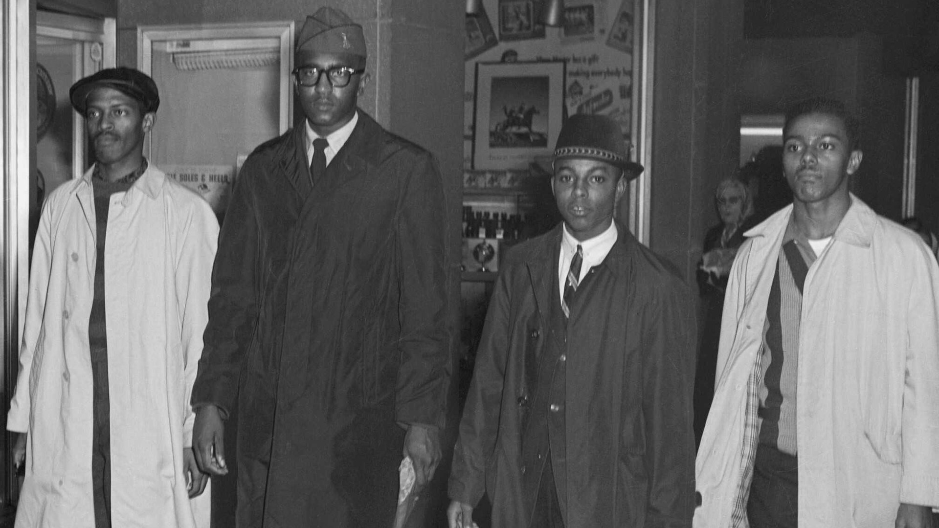 Four young Black students walking together in Greensboro in 1960 during the lunch counter sit in movement