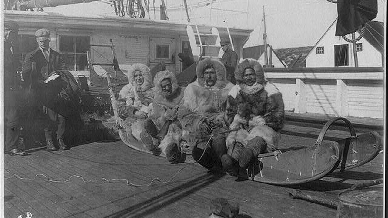 Expedition members including Matthew Henson seated on the sledge that went to the North Pole