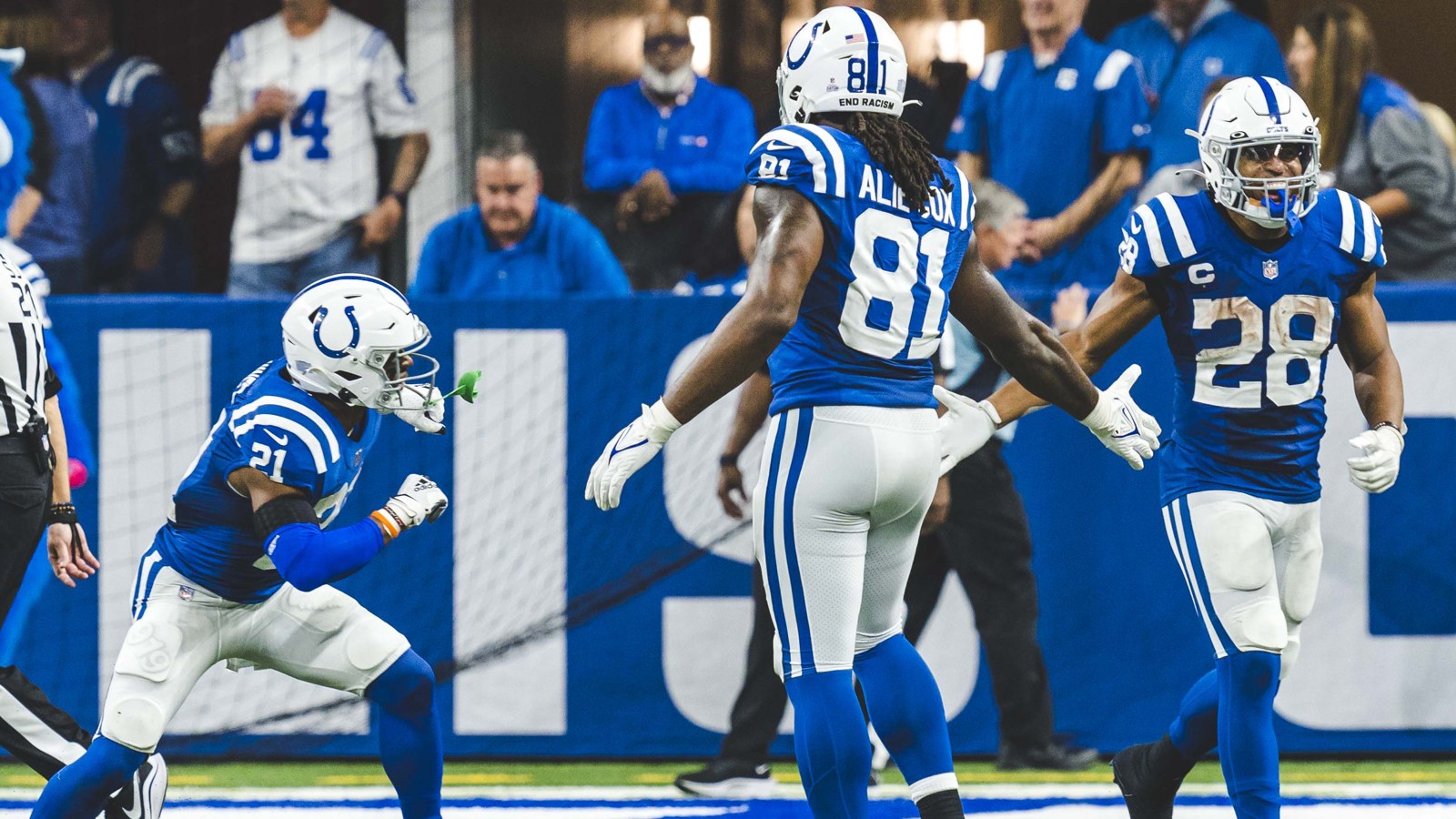 Jonathan Taylor celebrating with Mo Alie Cox and Nyheim Hines in Indianapolis Colts uniforms