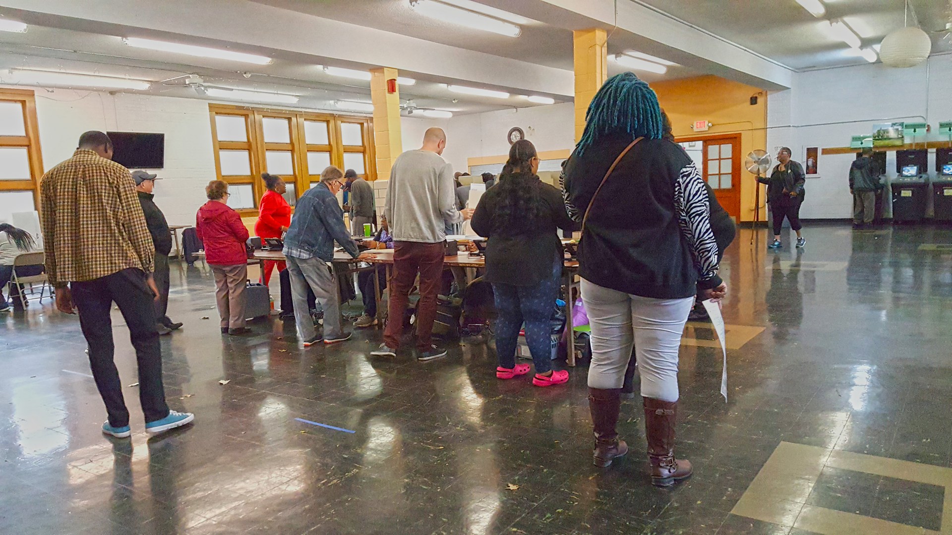 Voters casting ballots at a polling place