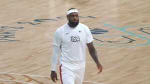 LeBron James on court in a USA warmup shirt at the Paris 2024 Olympic Games