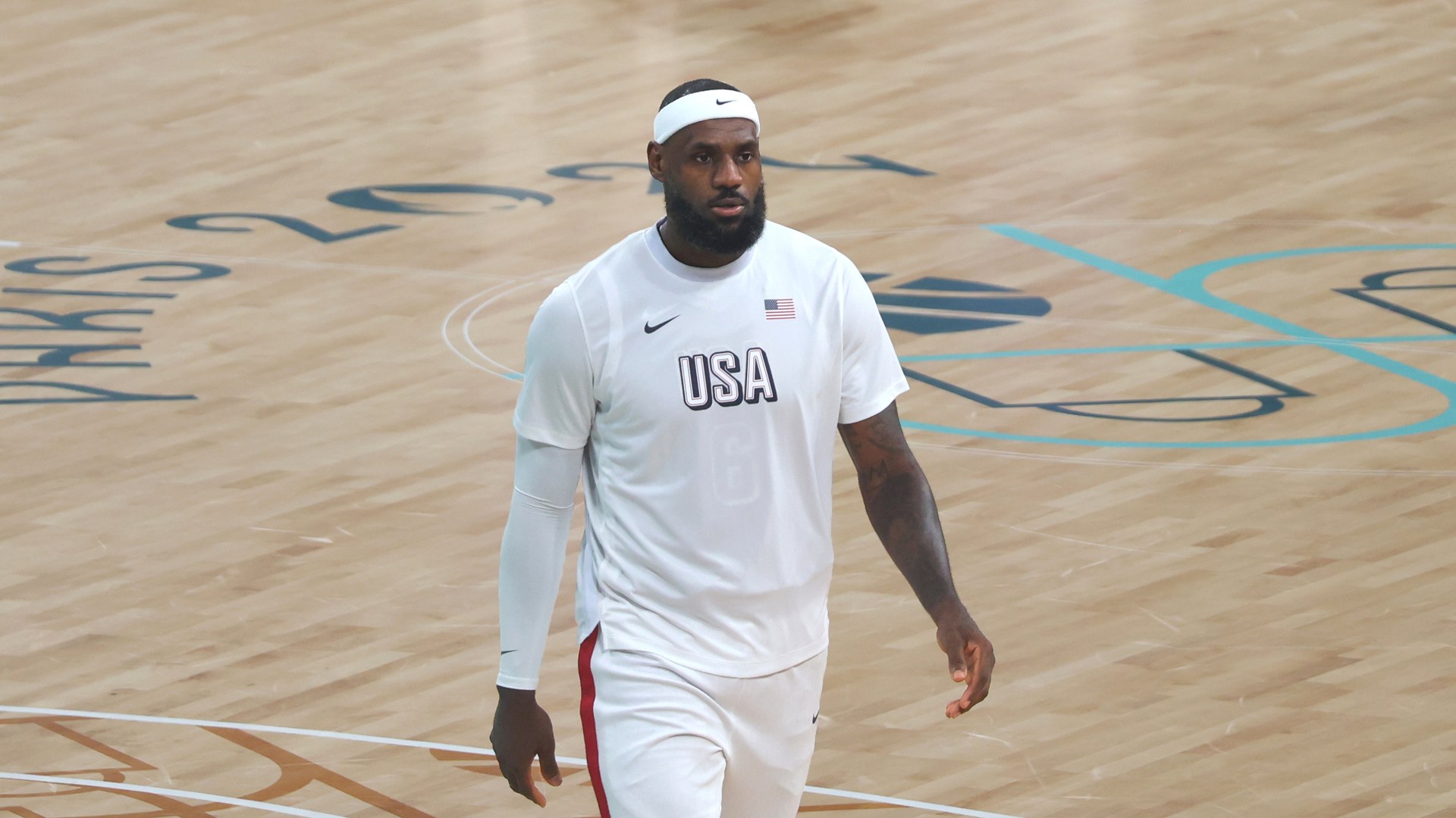 LeBron James on court in a USA warmup shirt at the Paris 2024 Olympic Games