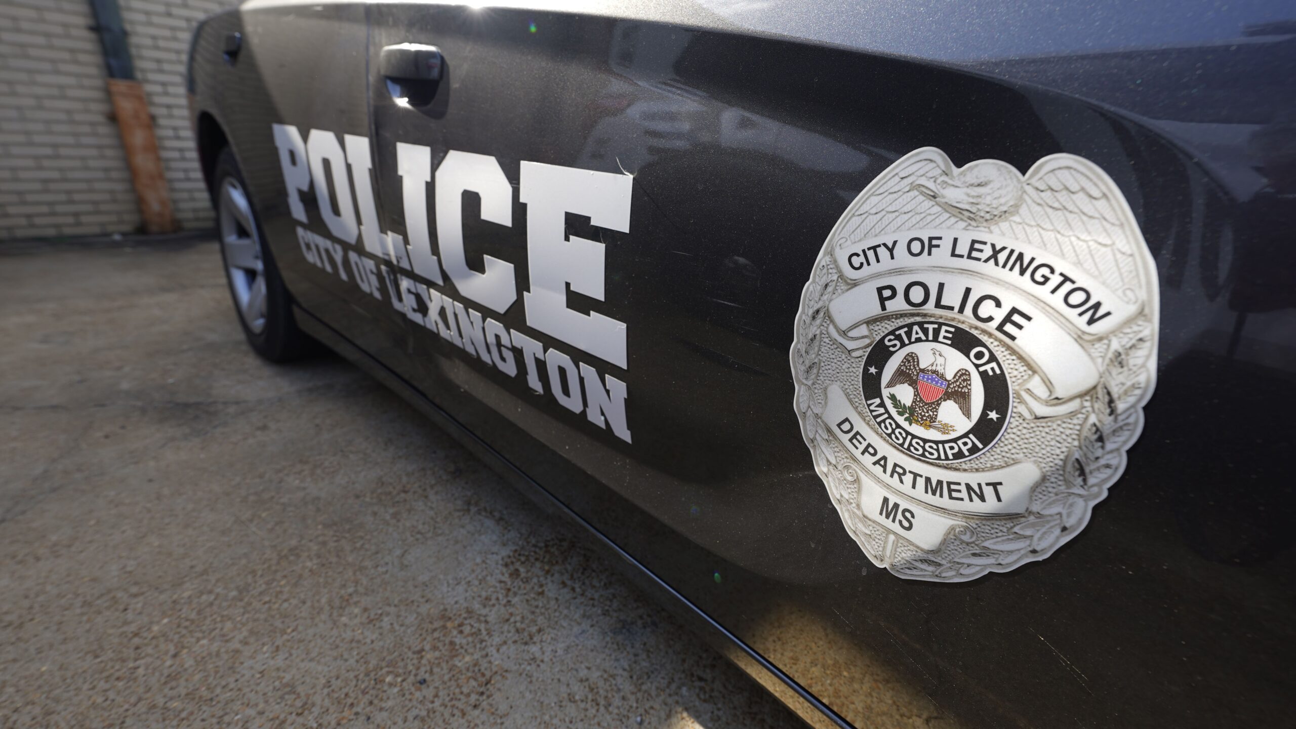 A Lexington Mississippi police cruiser parked outside the police facility near the town square
