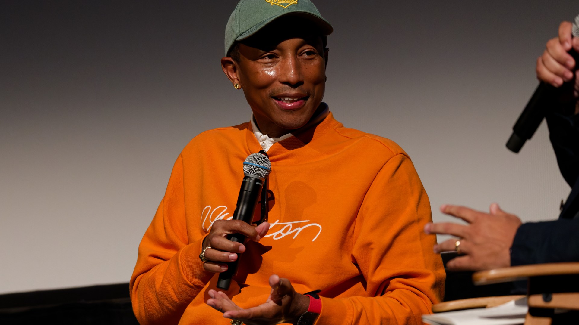 Pharrell Williams speaking at a film festival