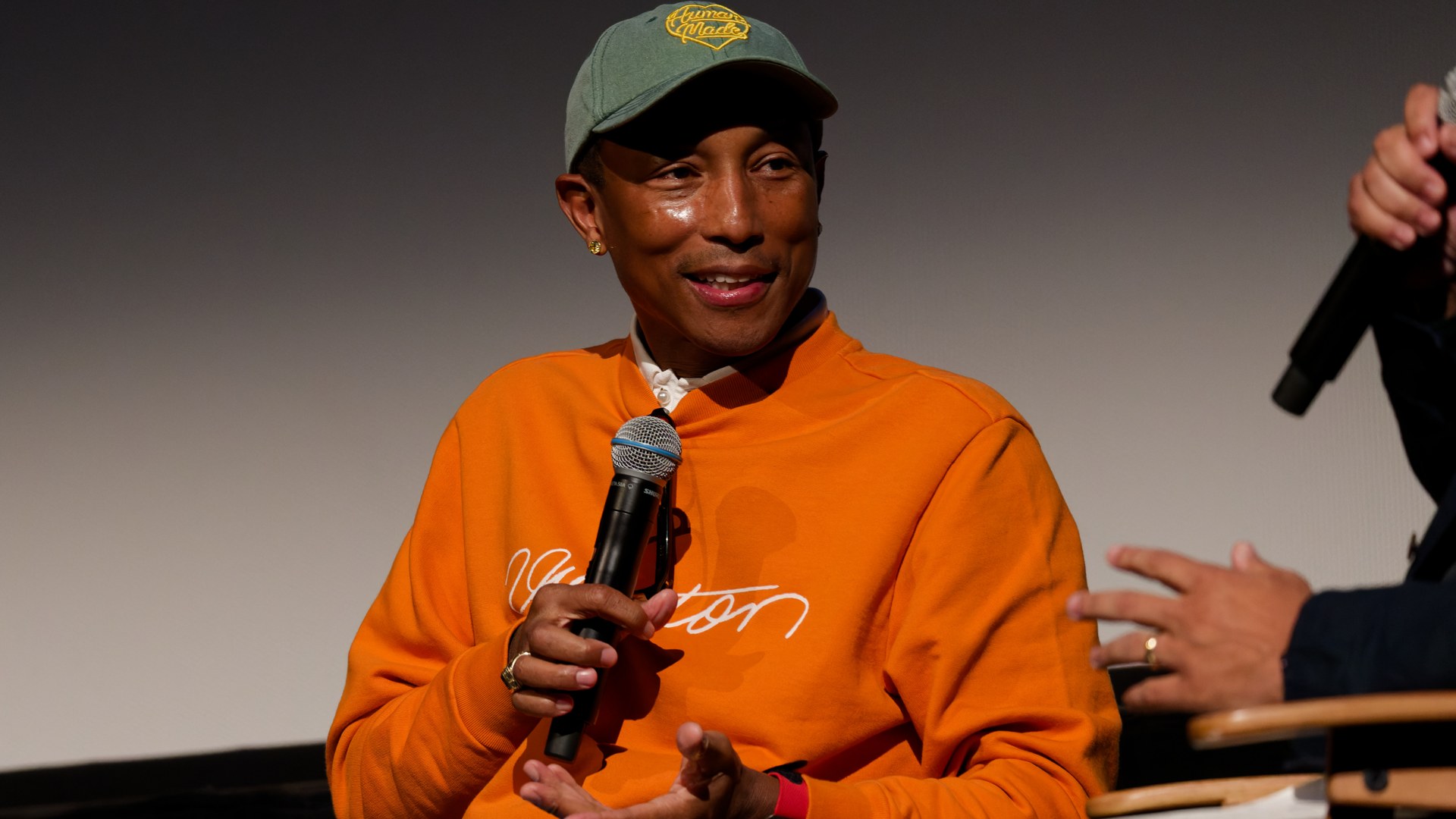 Pharrell Williams photographed at a festival in 2024