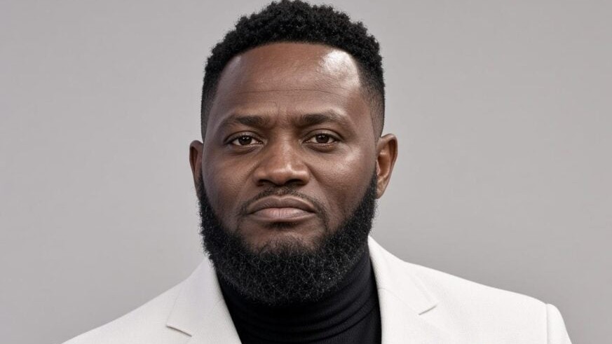 Portrait of Prophet Israel T. Ford wearing a white blazer over a black turtleneck