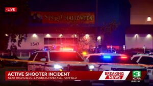 Police vehicles and crime scene tape outside the Spirit Halloween store at Solano Town Center in Fairfield on Friday night