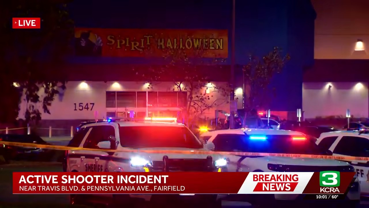 Police vehicles and crime scene tape outside the Spirit Halloween store at Solano Town Center in Fairfield on Friday night