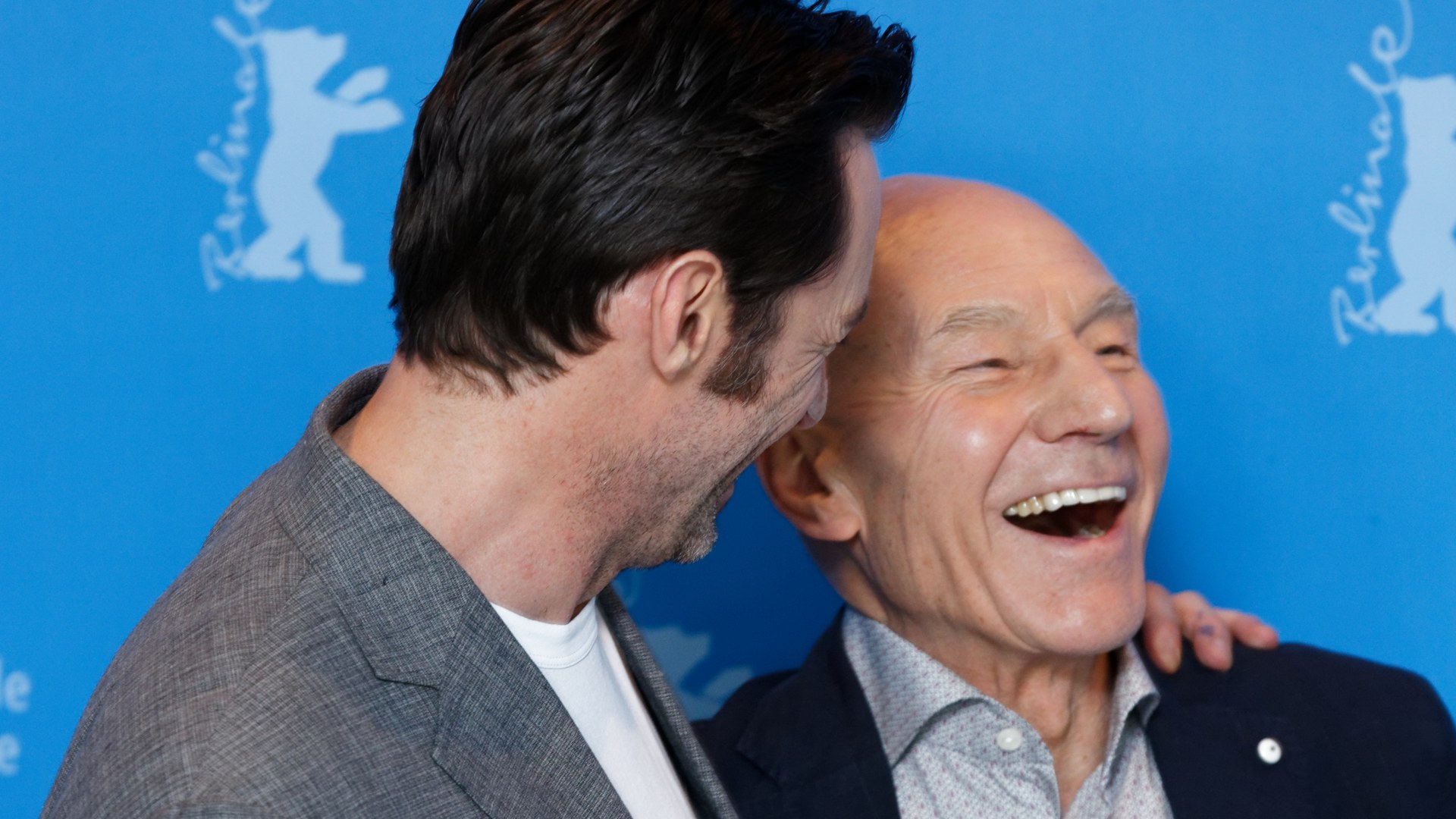 Patrick Stewart laughing with Hugh Jackman at the Logan photo call in Berlin in 2017