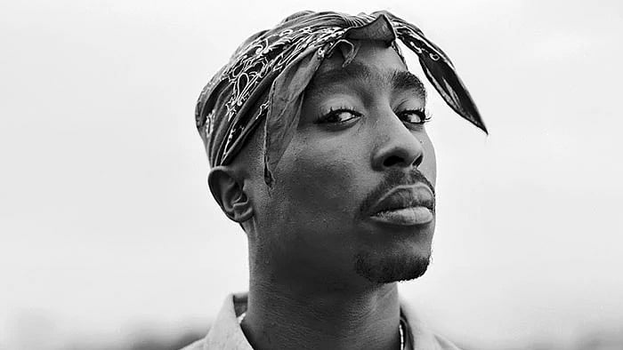 Memorial mural honoring Tupac Shakur in an urban neighborhood