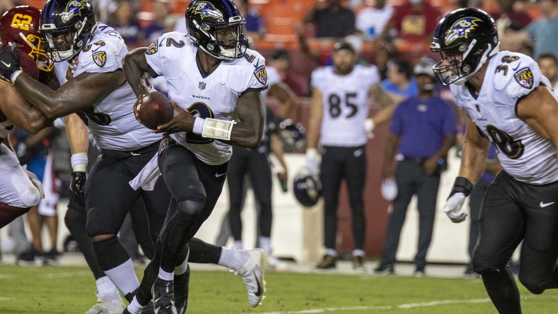 Tyler Huntley running with the football for the Baltimore Ravens in a game