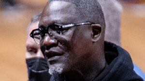 Dominique Wilkins in 2022 wearing glasses and a black hoodie